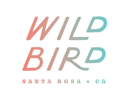 The image features the text "WILD BIRD" in gradient colors, with "SANTA ROSA • CA" written below in smaller letters.
